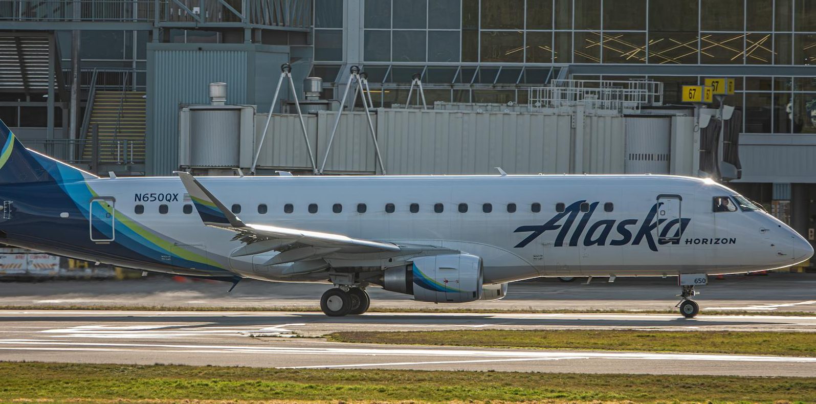 an alaska horizon commercial airplane at the airport