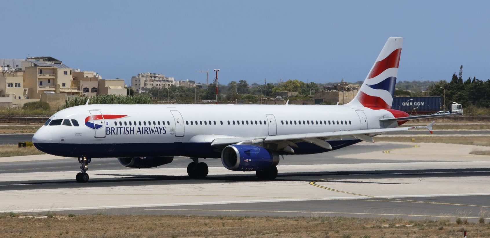 british airways aircraft taxiing on runway